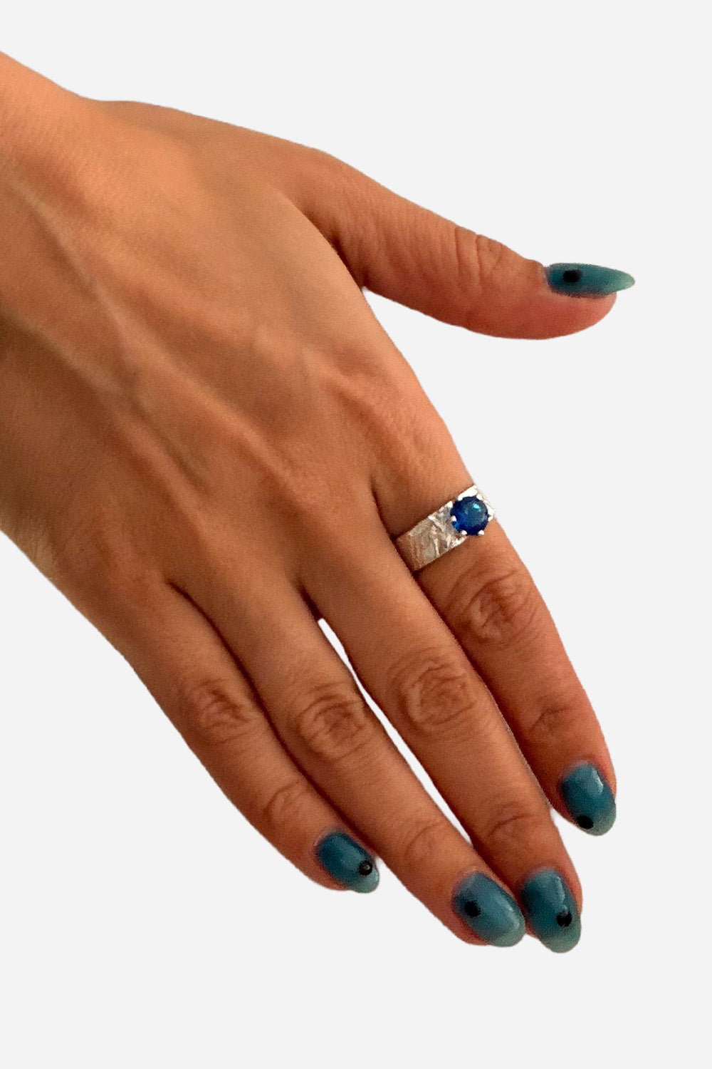 Silver ring with blue stone