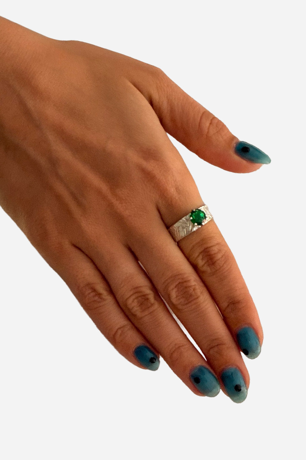 Silver ring with green stone